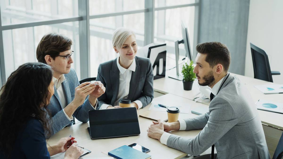 Virtual business meeting etiquette in UK: diverse team on video call with British participants