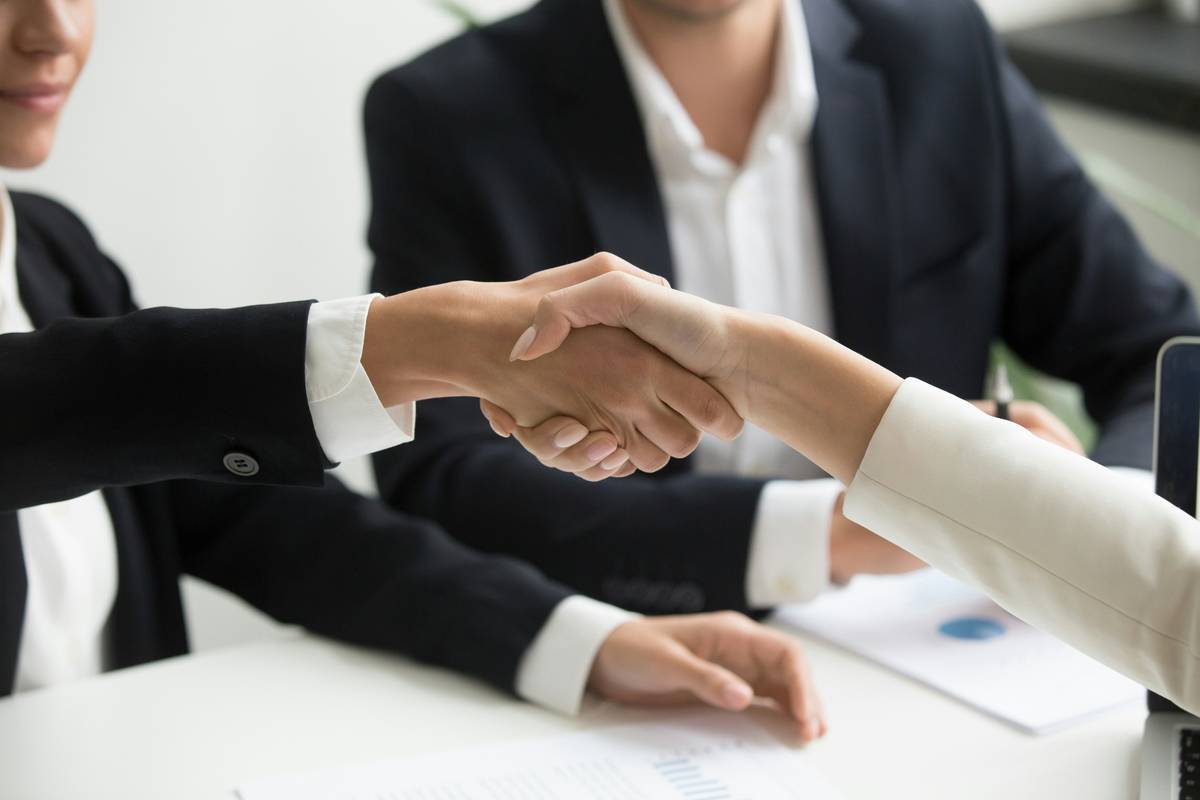 values etiquette training: diverse professionals role-playing international business meeting scenario